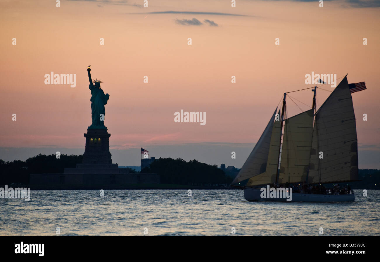 Statue of Liberty and sailing vessel New York harbour Stock Photo Alamy