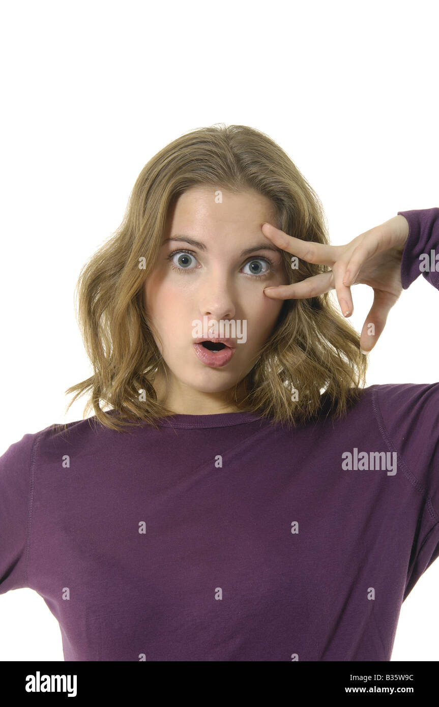 Portrait of a young woman looking surprised Stock Photo - Alamy