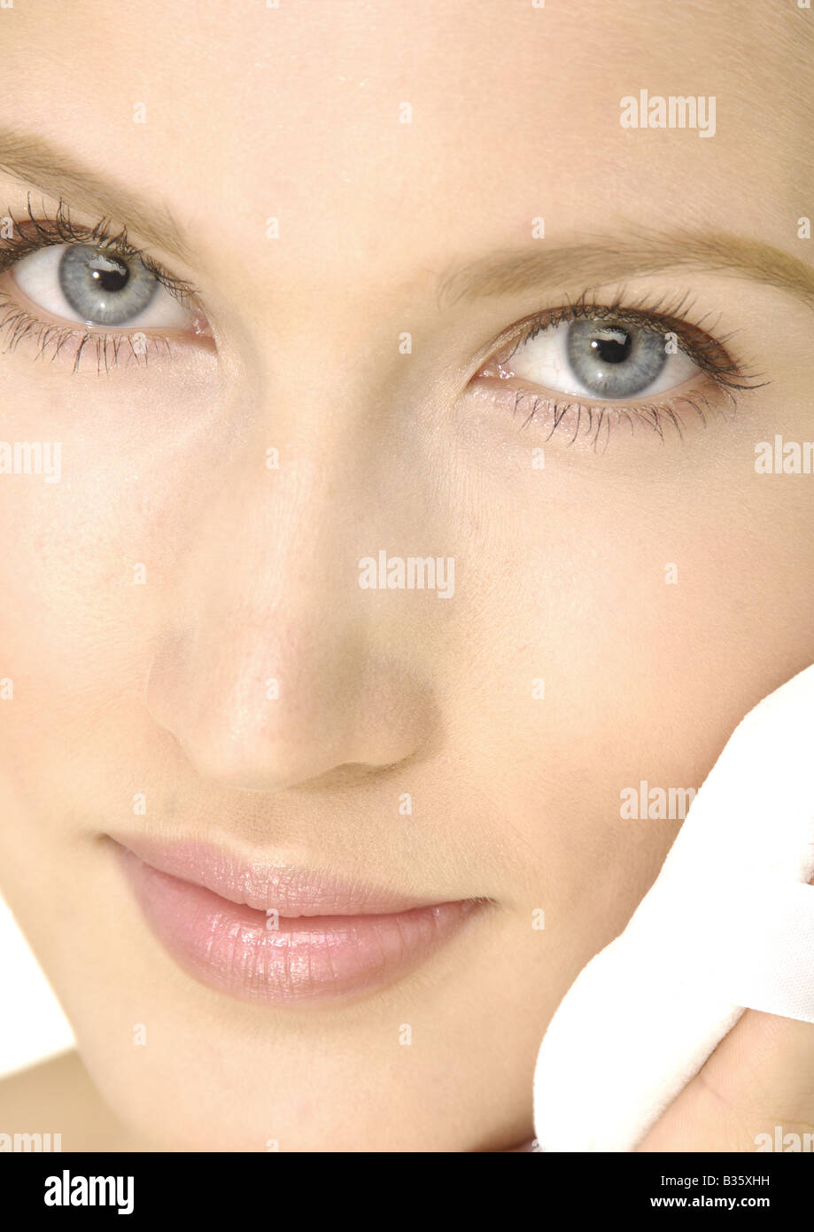 Beautiful woman applying powder using hi-res stock photography and ...