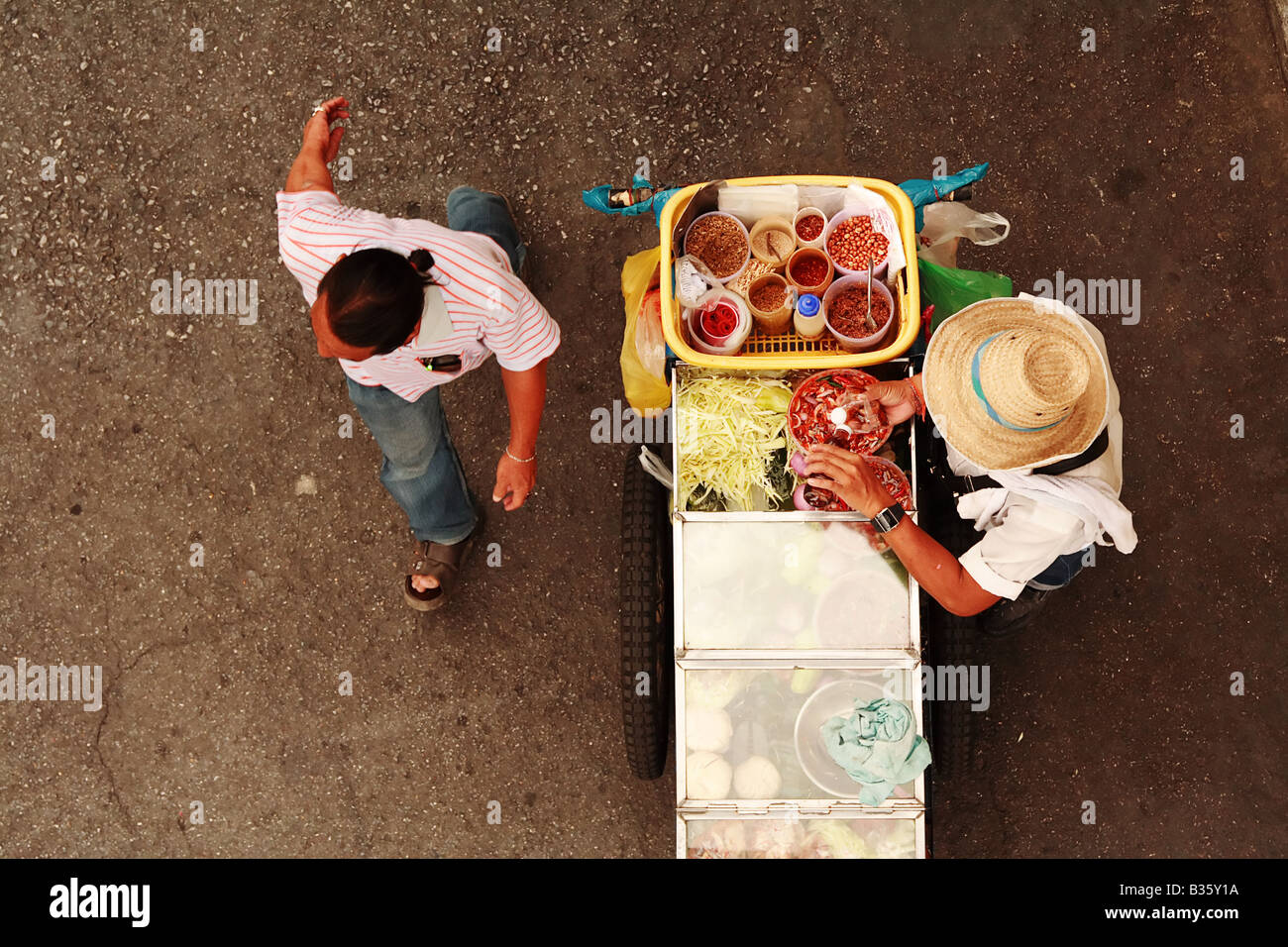 Street food is food obtainable from a streetside vendor, often from a makeshift or portable stall. Stock Photo