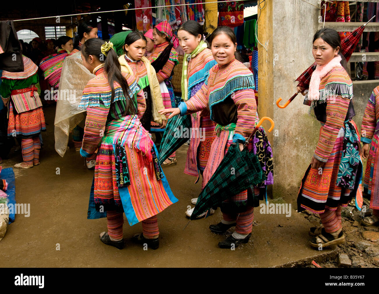 A group of Flower Hmong girls enter a market Northern Vietnam Stock Photo