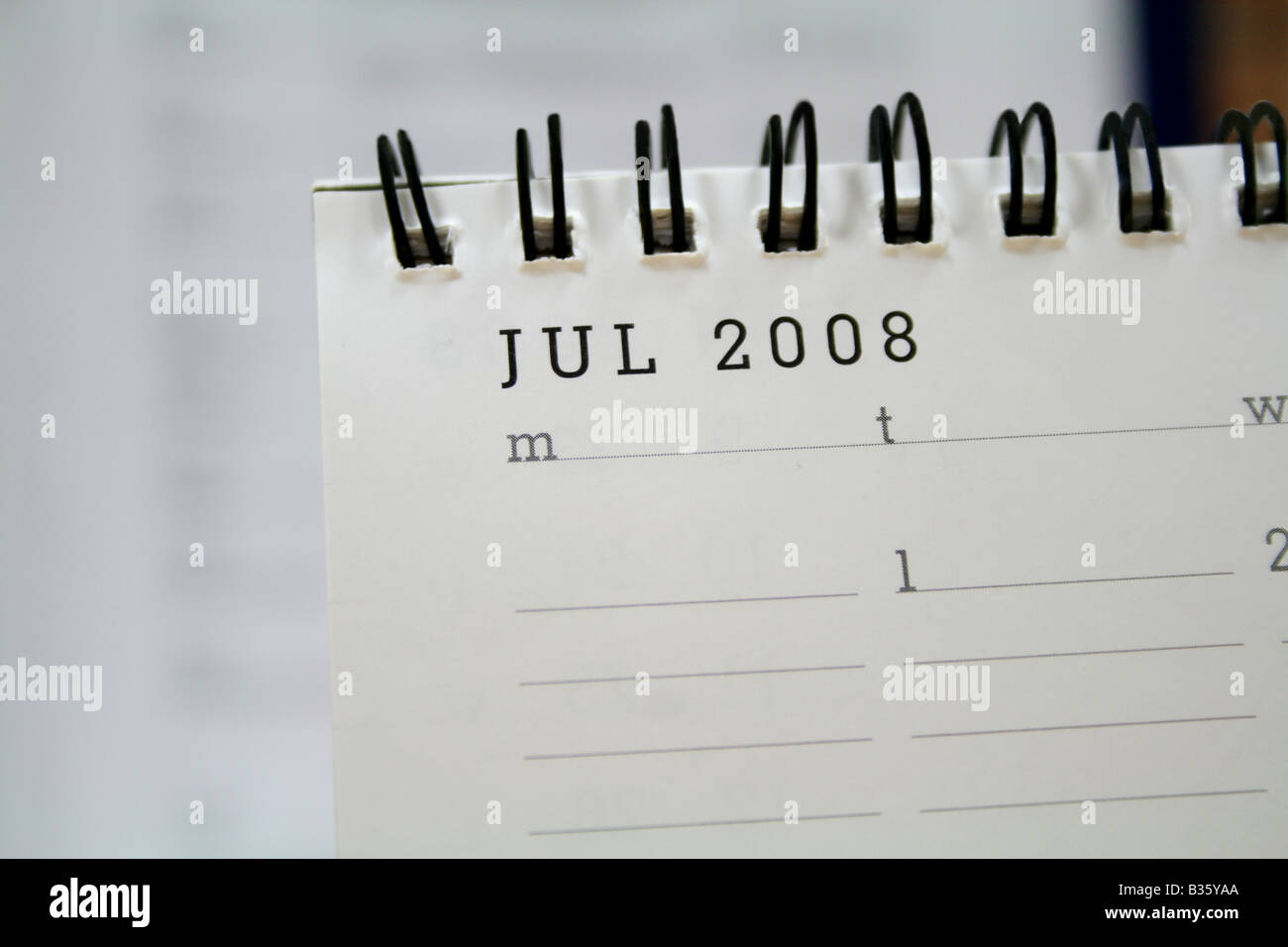 Special white desk top corporate calendar showing July 2008 highlighting it as a busy and festive month Stock Photo