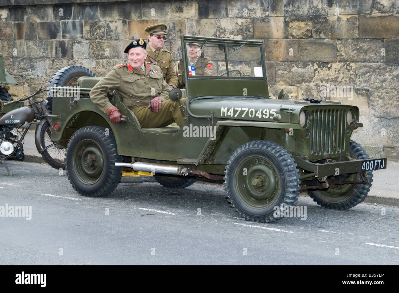 1940 Jeep Wartime American army vehicle and people at Pickering Living History 1940s World War II Wartime War Weekend, North Yorkshire, England, UK Stock Photo