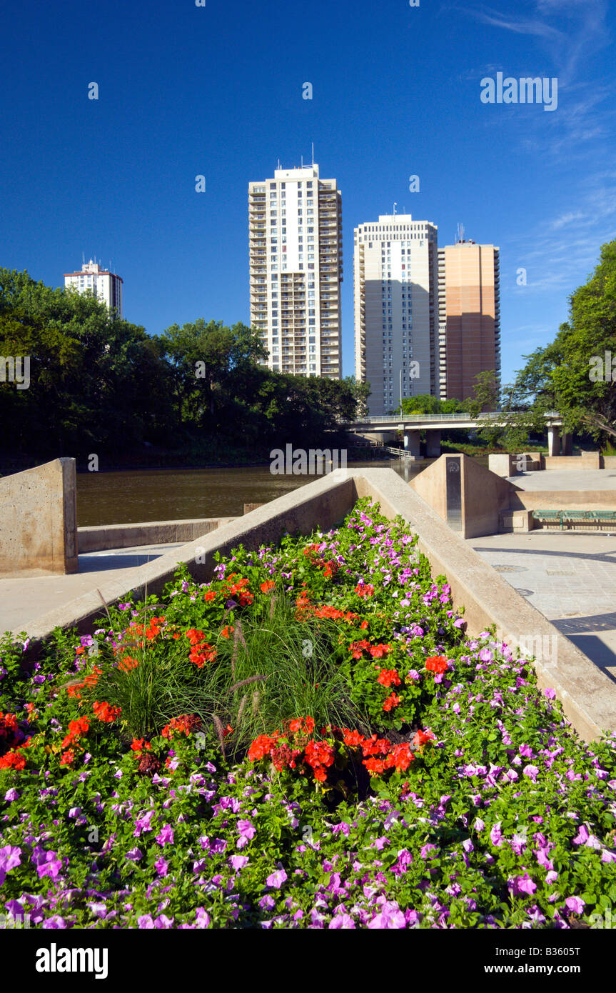 The Red river walk with flowers and apartment blocks in winnipeg