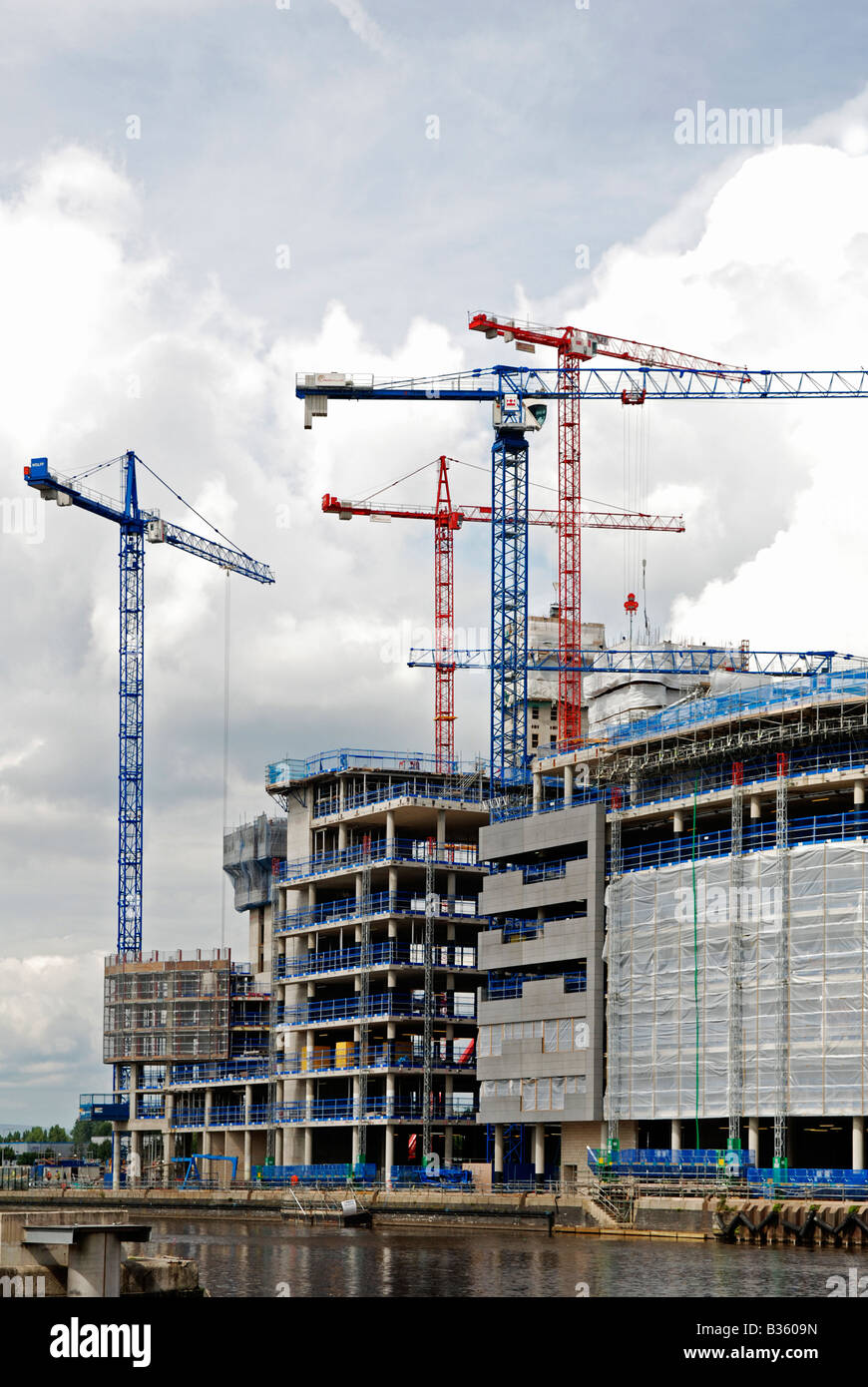 high rise cranes at a new development on salford quays,manchester,uk Stock Photo