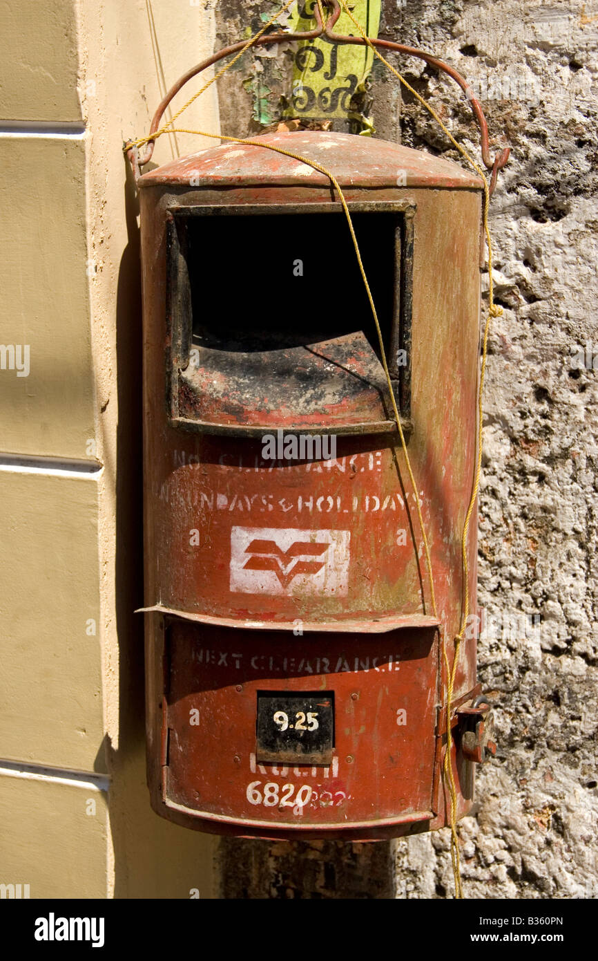 A postbox within Kochi in Kerala, India. The logo of India Post can be seen on the front of the postbox. Stock Photo