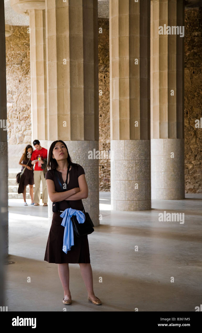 SPAIN Barcelona Woman look at ceiling in Hall of 100 Columns Parc Guell designed by Antoni Gaudi architect Modernisme Stock Photo