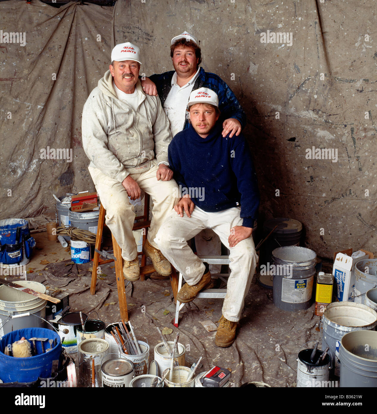 Portrait of father and sons, professional painters Stock Photo