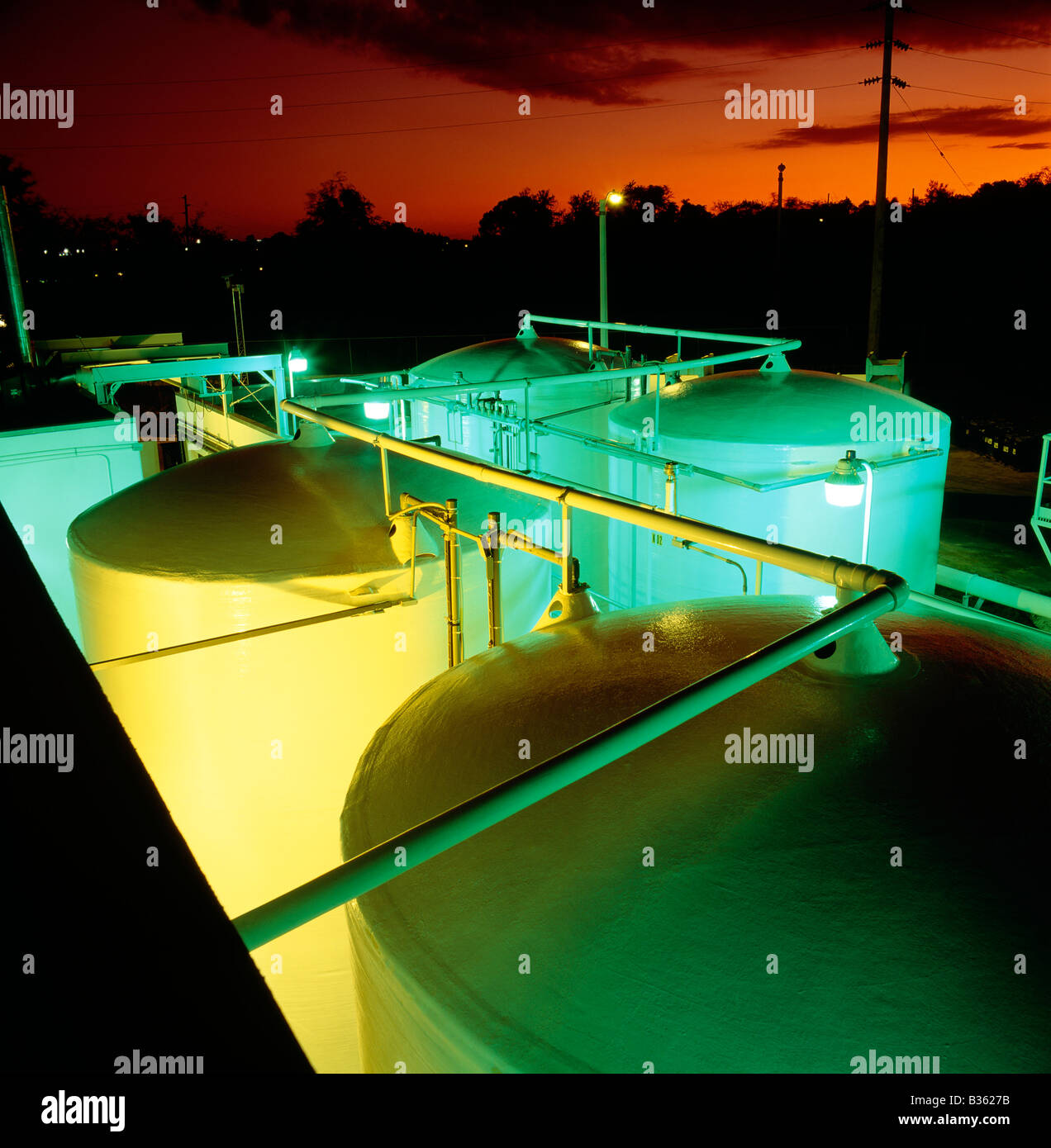 Dusk view of chemical storage tanks at manufacturing facility in Puerto