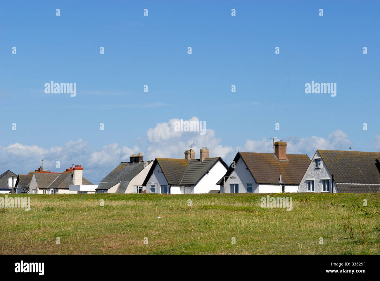Seafront housing along the coastline near Prestatyn, North Wales Stock Photo