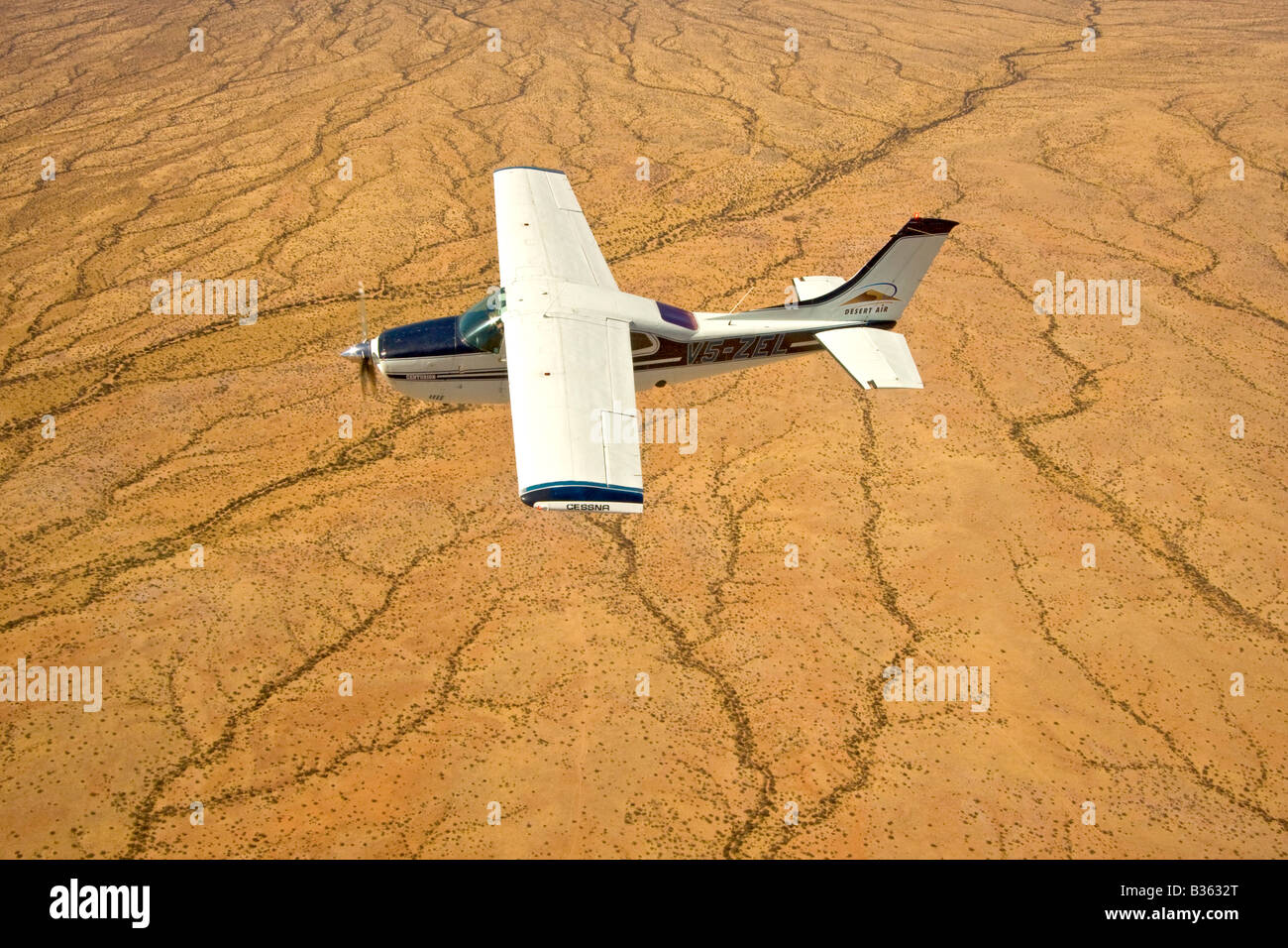 Aerial view of desert landscape of north central Namibia Africa with a small airplane in view Stock Photo