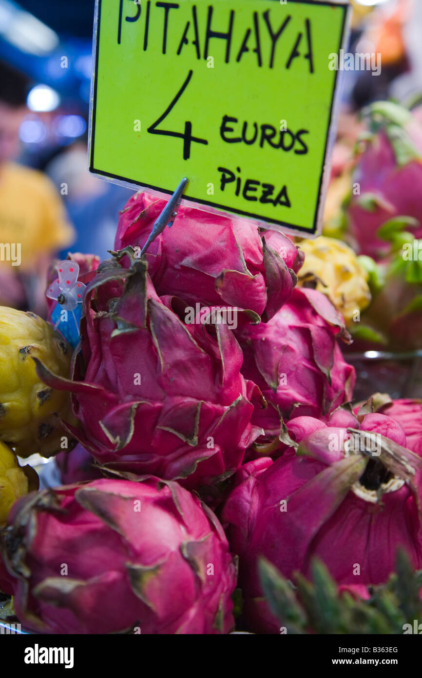 SPAIN Barcelona Red pitahaya for sale in La Boqueria produce market known as dragon fruit pitaya price in Euros Stock Photo