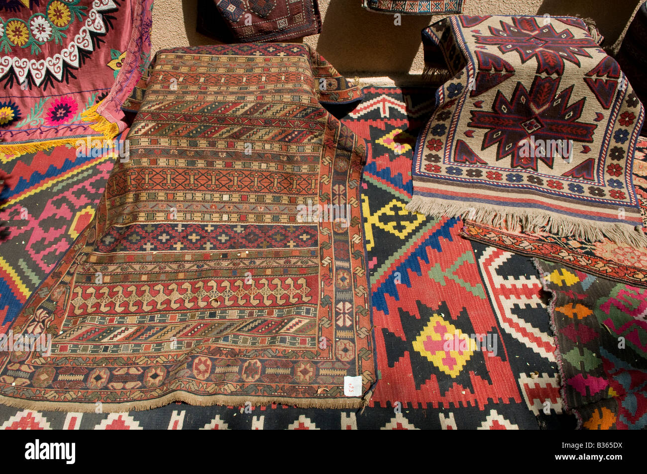 Richly coloured traditional fabric for sale at the market in a shop