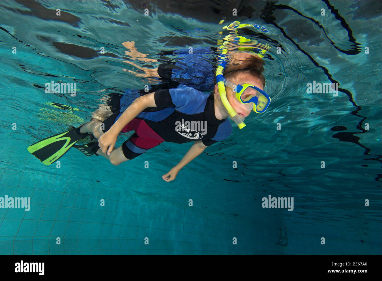Boy swimming with snorkel in pool from underwater Stock Photo Alamy
