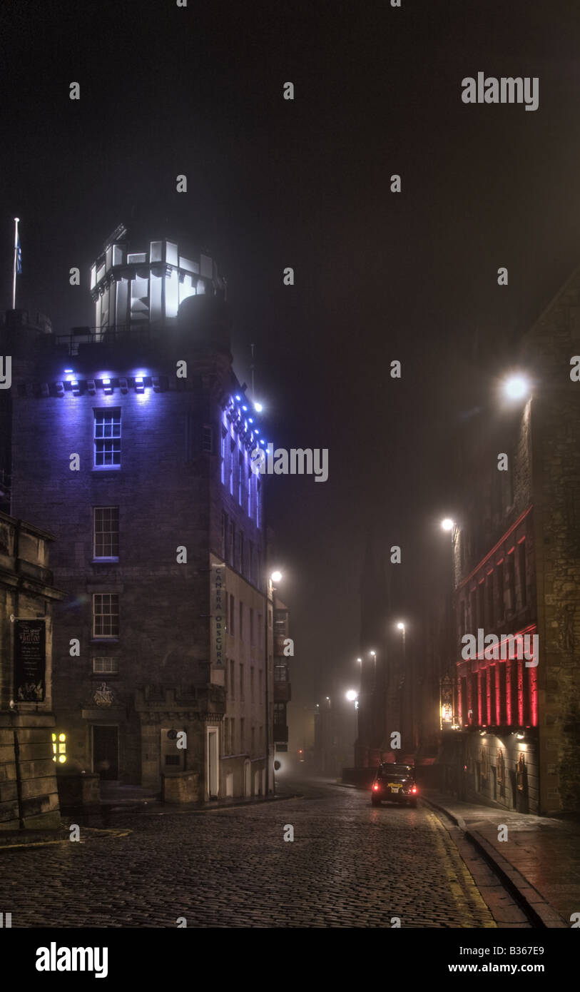 The Camera Obscura and The Witchery restaurant on the Royal Mile on a foggy night Edinburgh Stock Photo