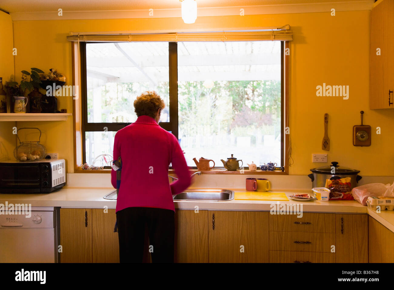 Rear view mature woman washing hi-res stock photography and images - Alamy