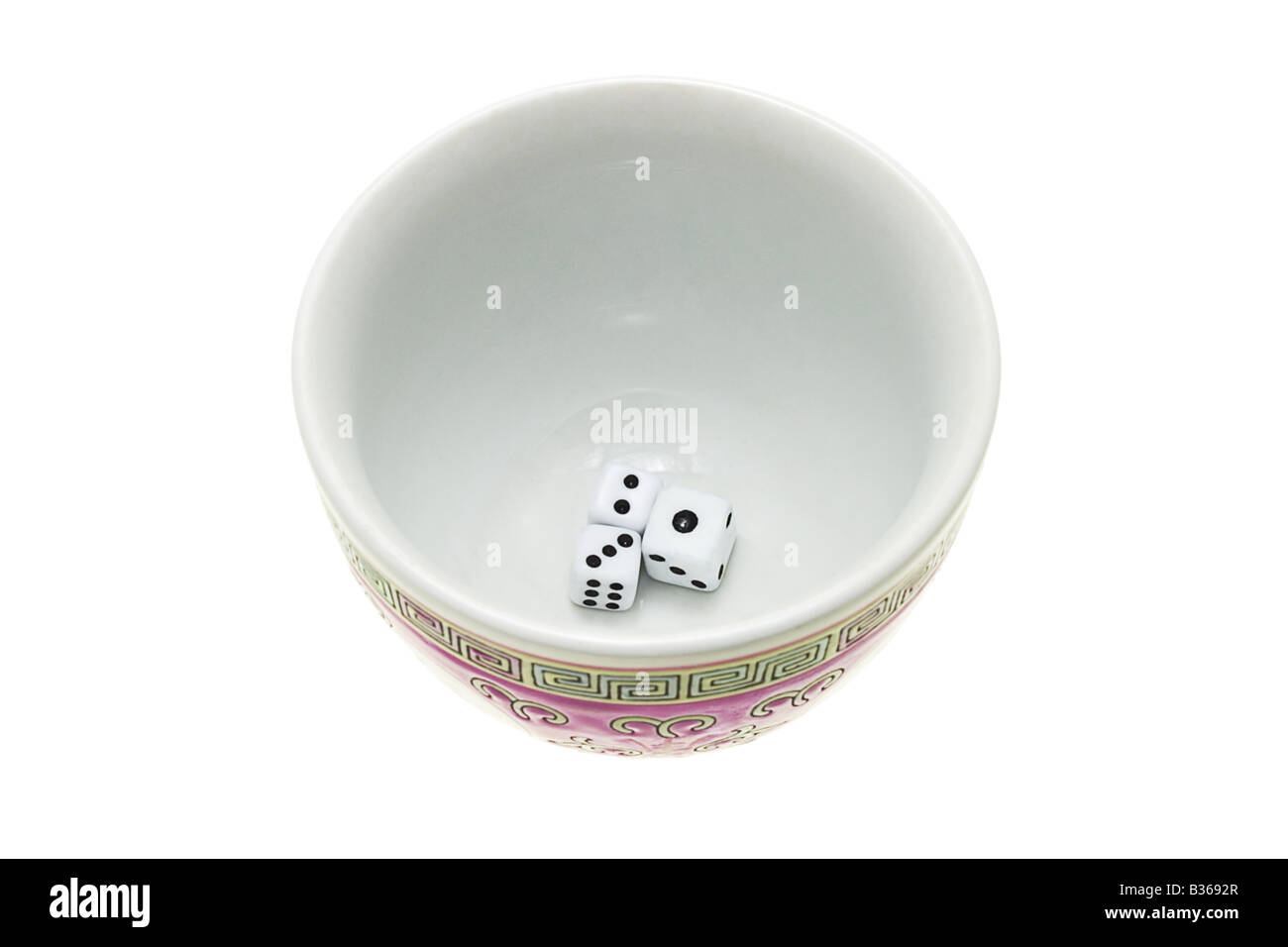 Dice in Chinese traditional tea cup on white background Stock Photo Alamy