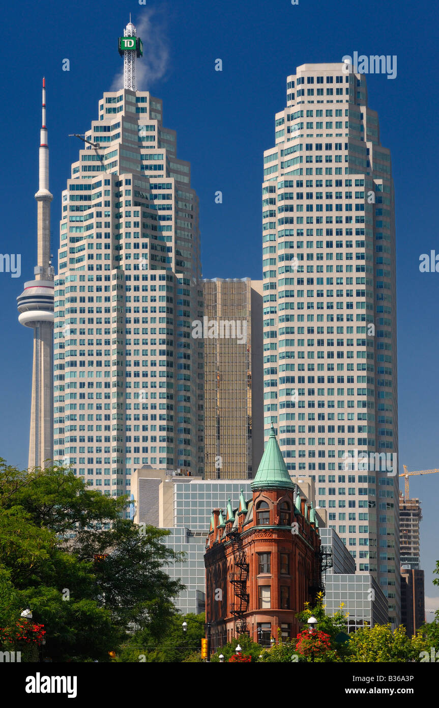 Downtown Toronto financial high rise towers skyscrapers and CN tower dwarf historic red brick Flatiron building from St Lawrence Market Stock Photo