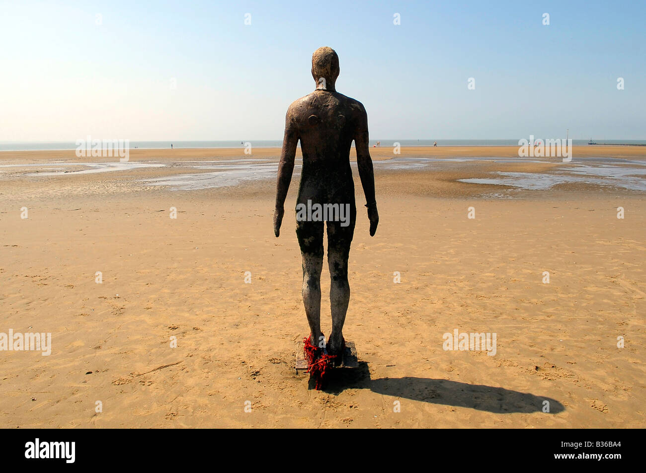another place ironman anthony gormley sculpture art crosby beach liverpool summer england uk travel tourism seaside coast Stock Photo