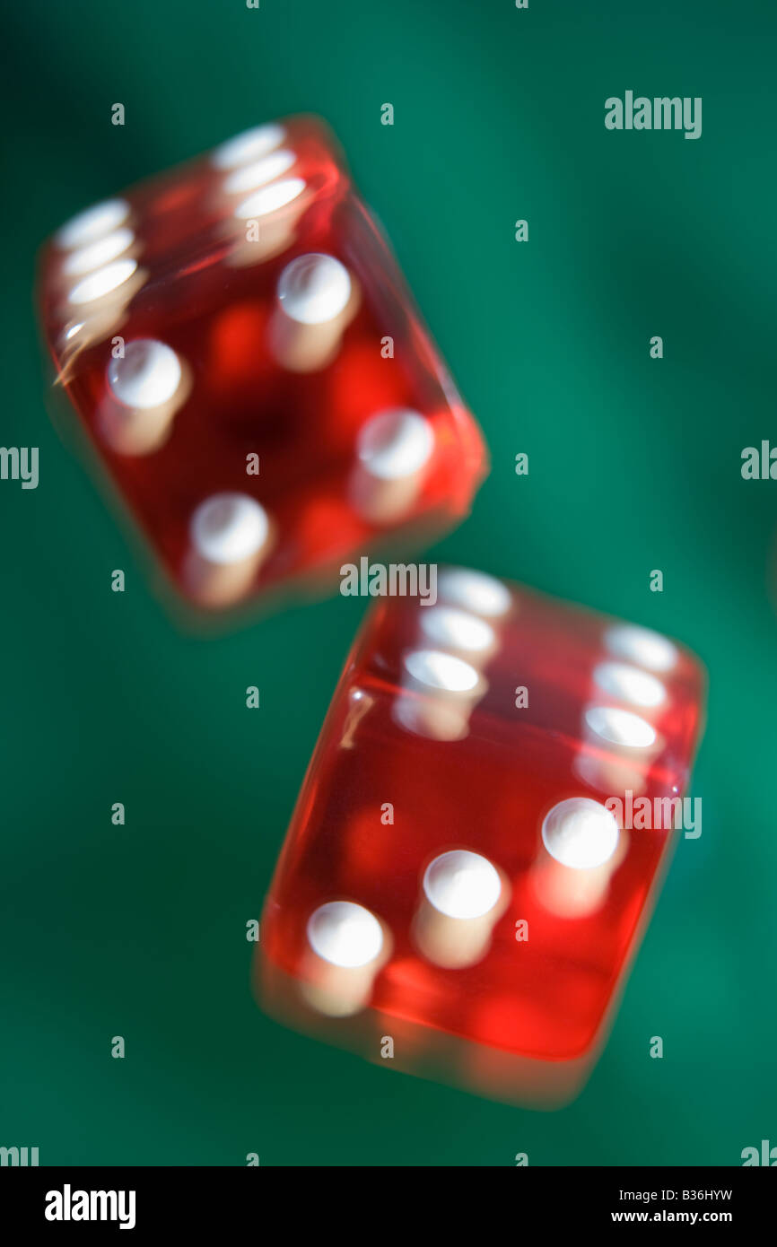 Dice rolling on a poker table (close up/blur) Stock Photo