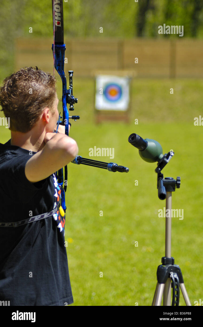 An archer takes aim at a long distance target Stock Photo Alamy