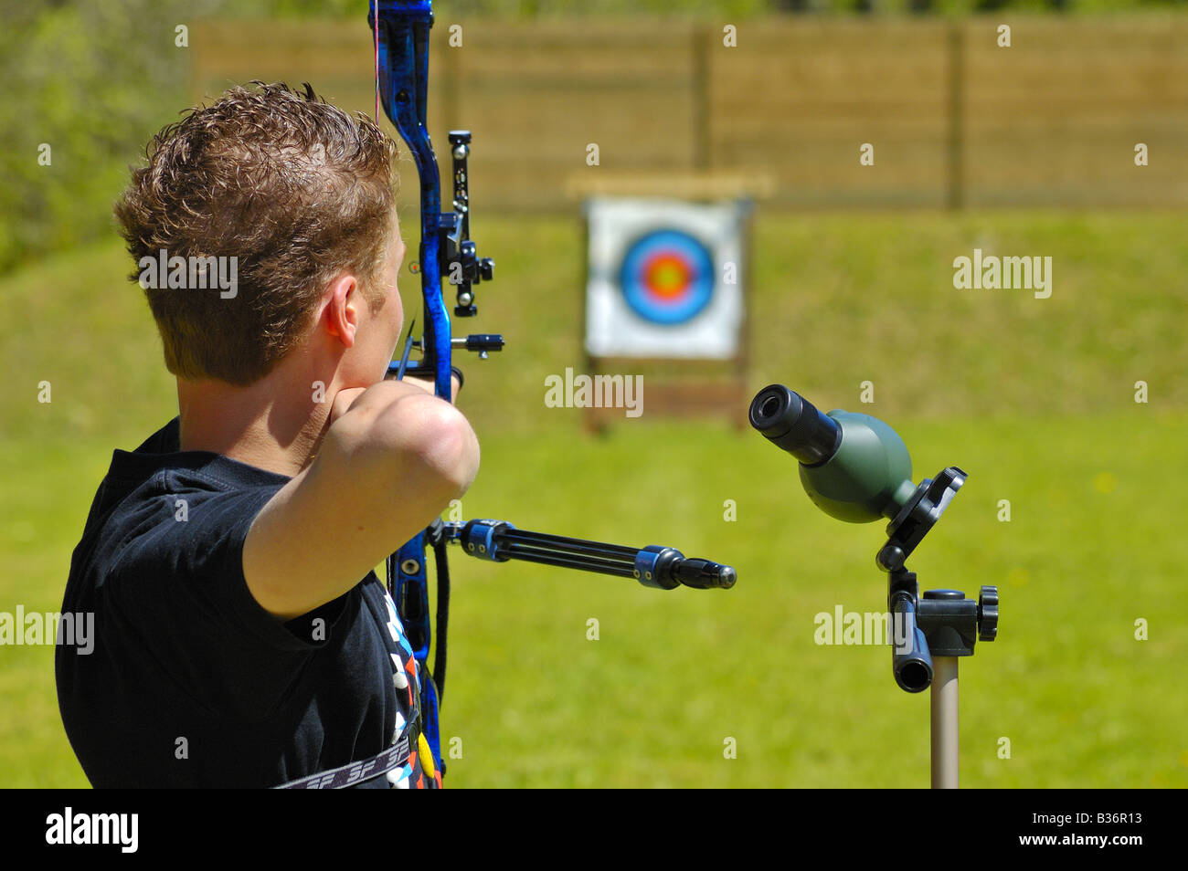 An archer takes aim at a long distance target Stock Photo Alamy
