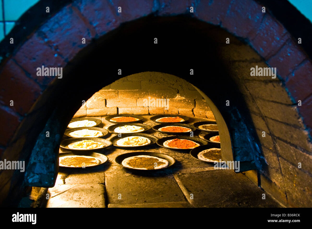 Small Pizzas in a Brick Oven in Latakkia Syria Stock Photo