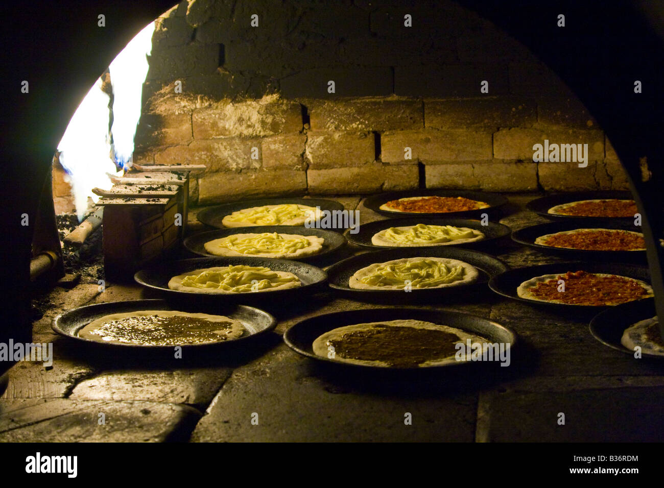 Small Pizzas in a Brick Oven in Latakkia Syria Stock Photo
