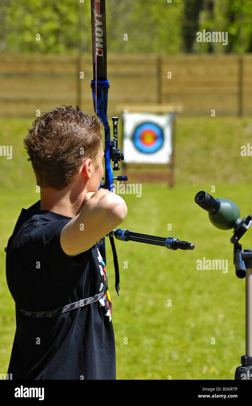 An archer takes aim at a long distance target Stock Photo Alamy