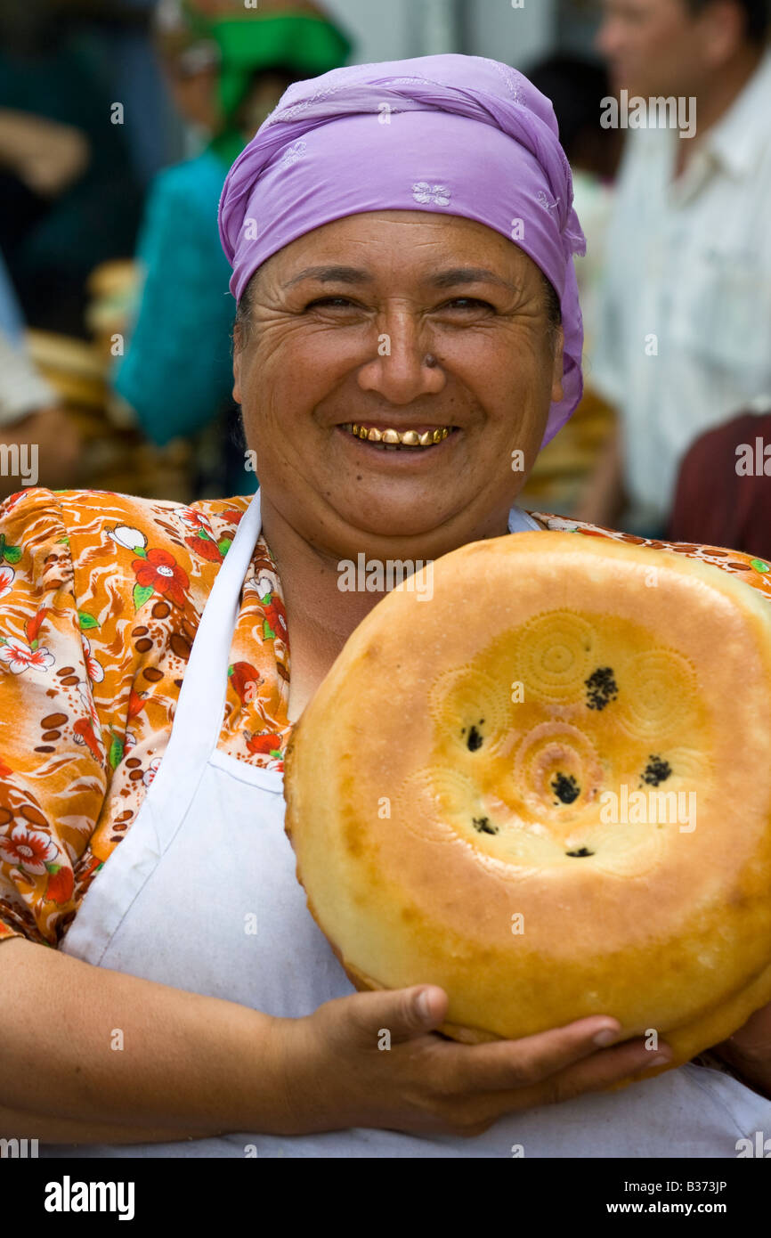 Uzbek Woman Selling Bread in the Siab Market in Samarkand Uzbekistan Stock Photo