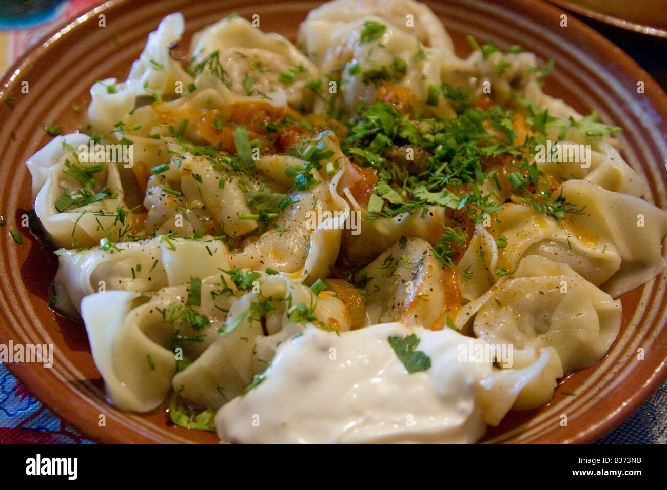 Chuchvara or Ravioli and sour Cream at a Chaikhana in the Siab Market in Samarkand Uzbekistan Stock Photo