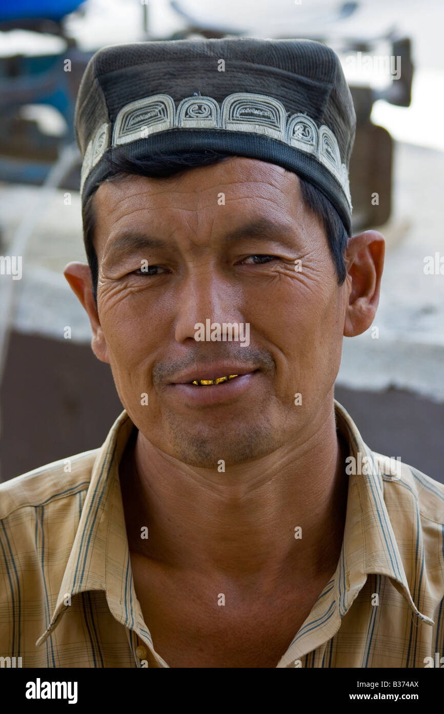 Uzbek Man Wearing a Traditional Hat at the Sunday Market in Uzbekistan Stock Photo