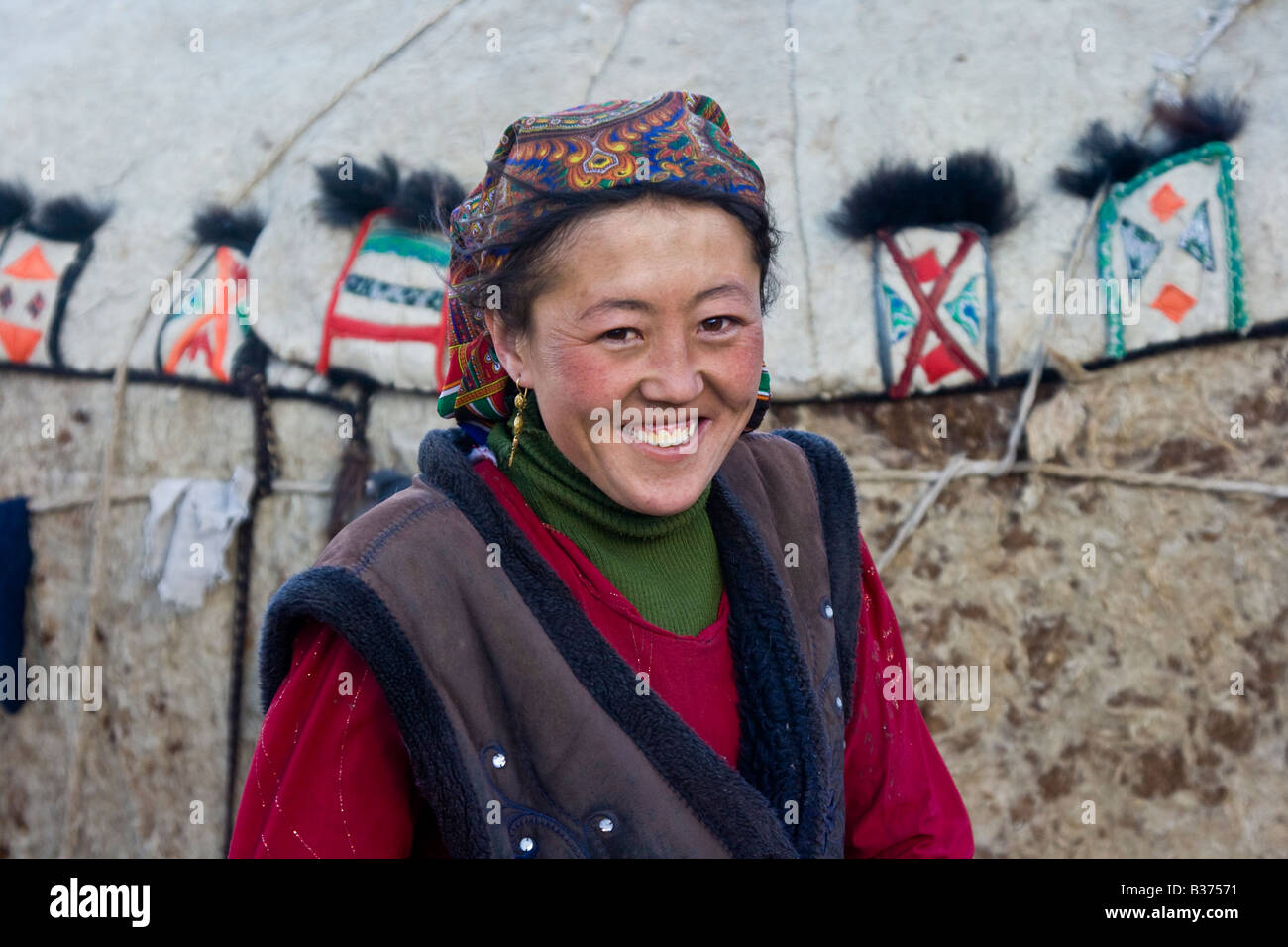 Beautiful Young Ethnically Kyrgyz Tajik Woman in Front of Her Family
