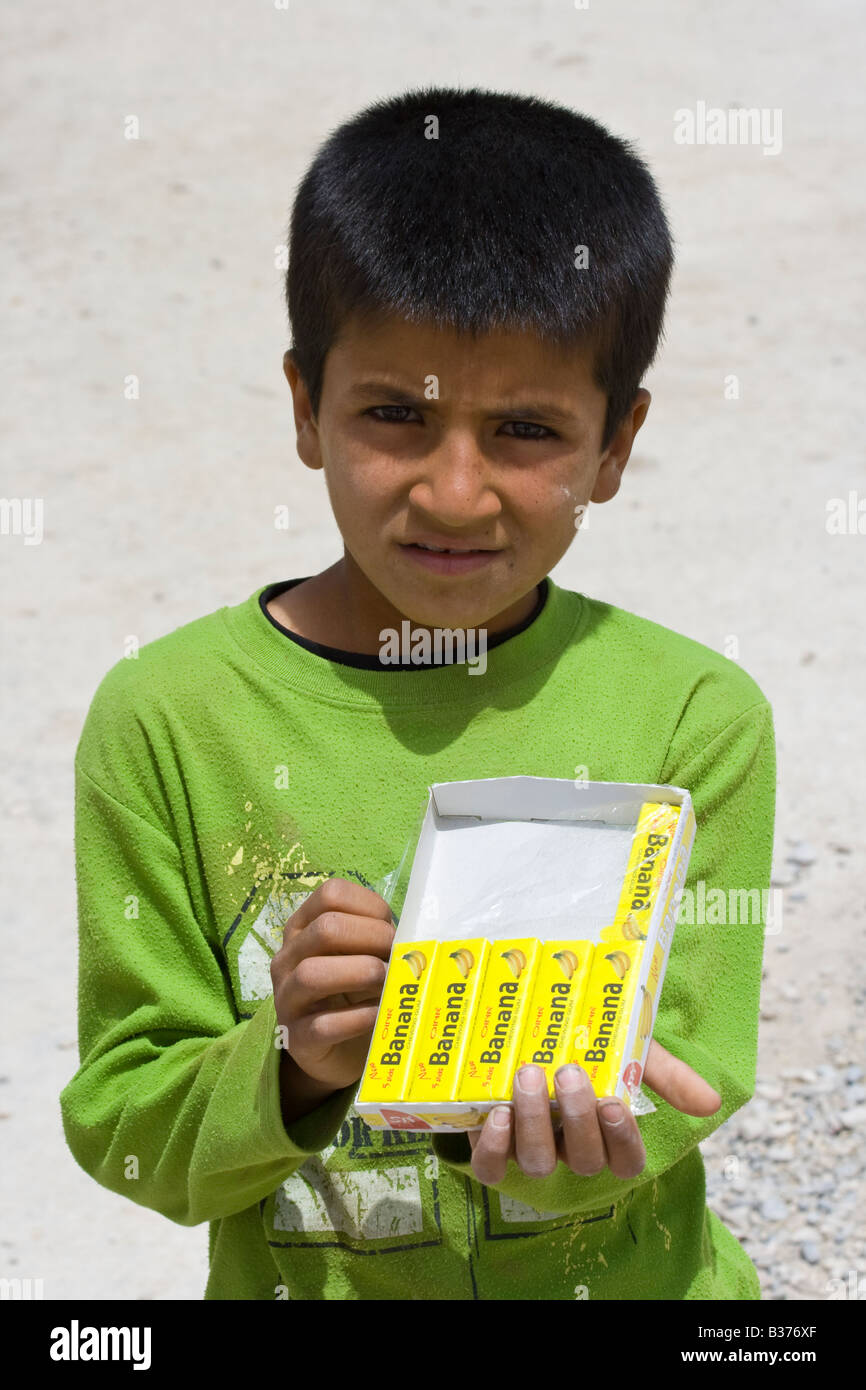 Poor Iranian Boy Selling Gum at the Ruins of Persepolis Stock Photo - Alamy