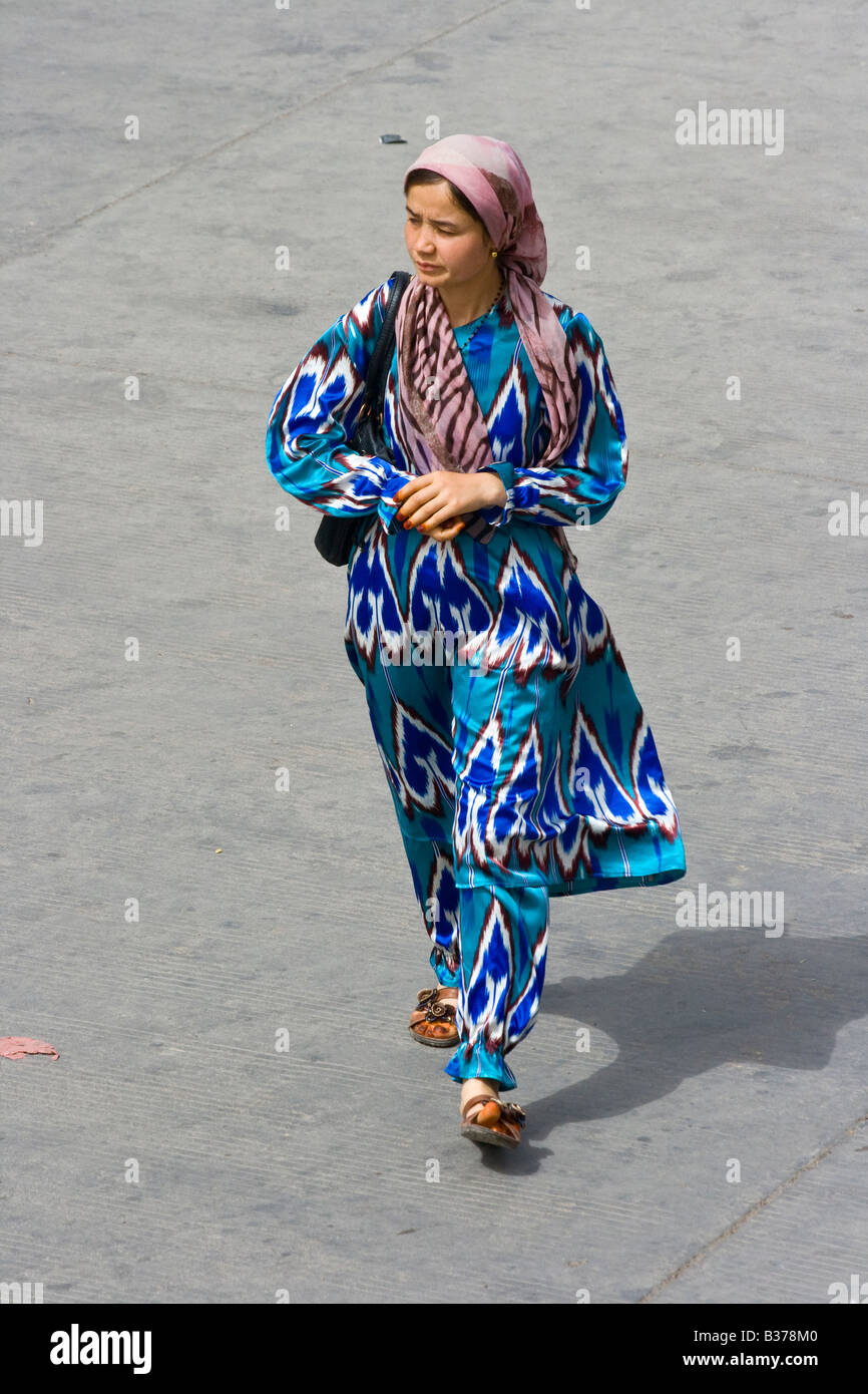 Young Uyghur Woman Wearing a Traditional Silk Dress in Old Kashgar in ...