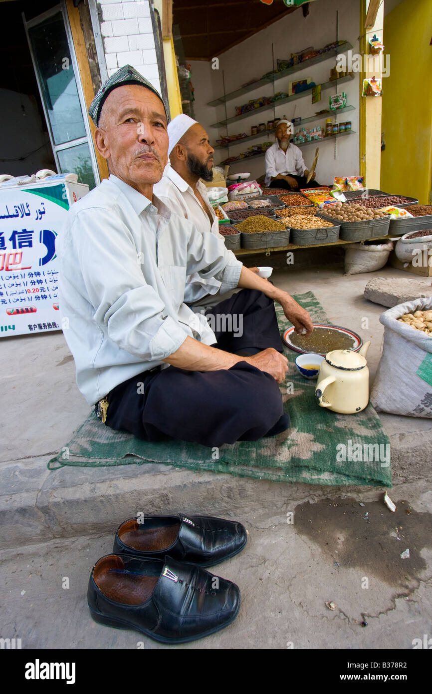 Uyghur Men in Kashgar in Xinjiang Province China Stock Photo