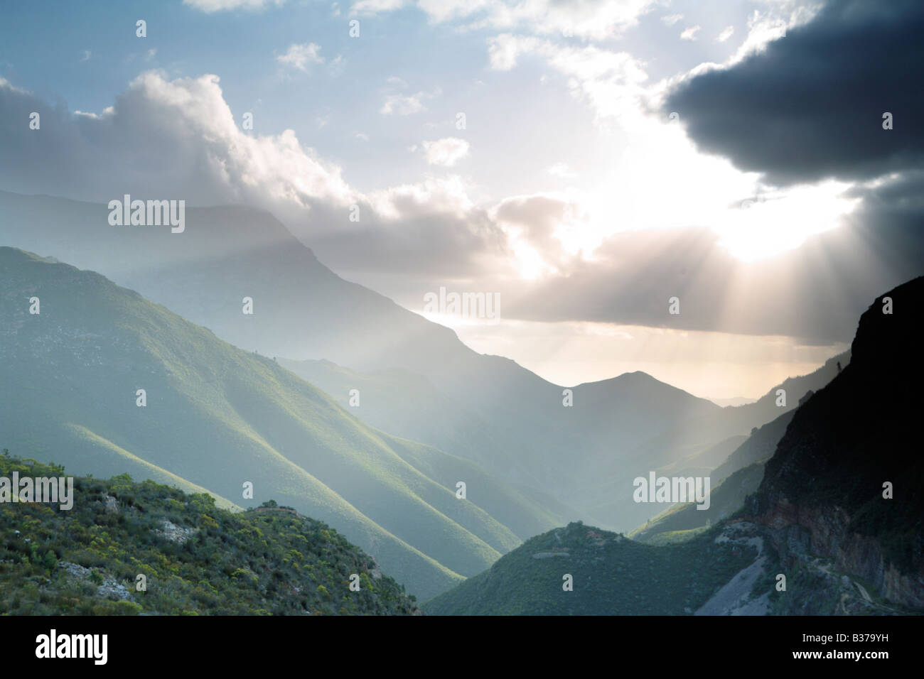 Sun rays over mountain Stock Photo
