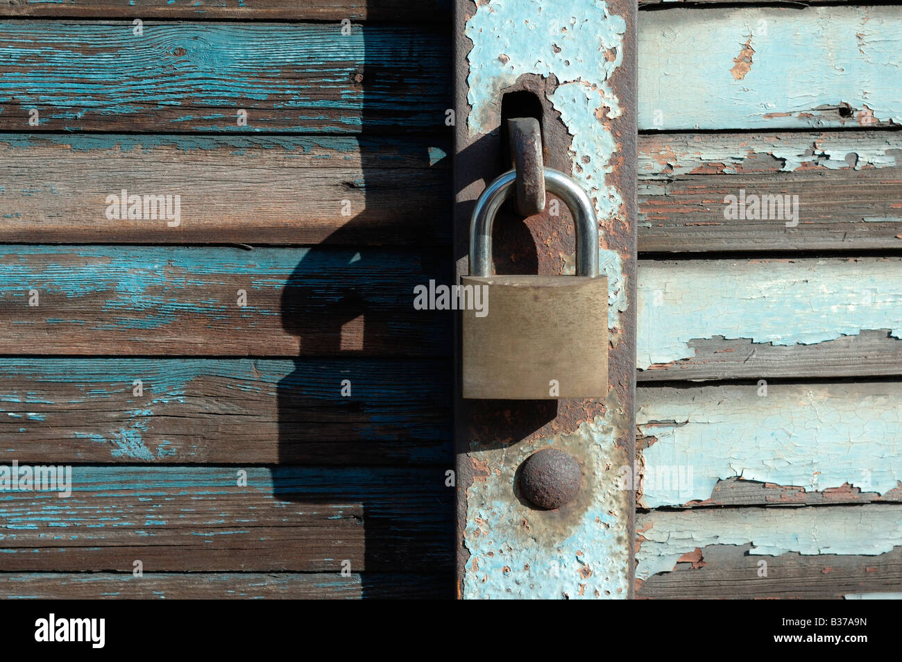 Padlock on the shutters of abandoned shop, Lindsey Street, smithfield