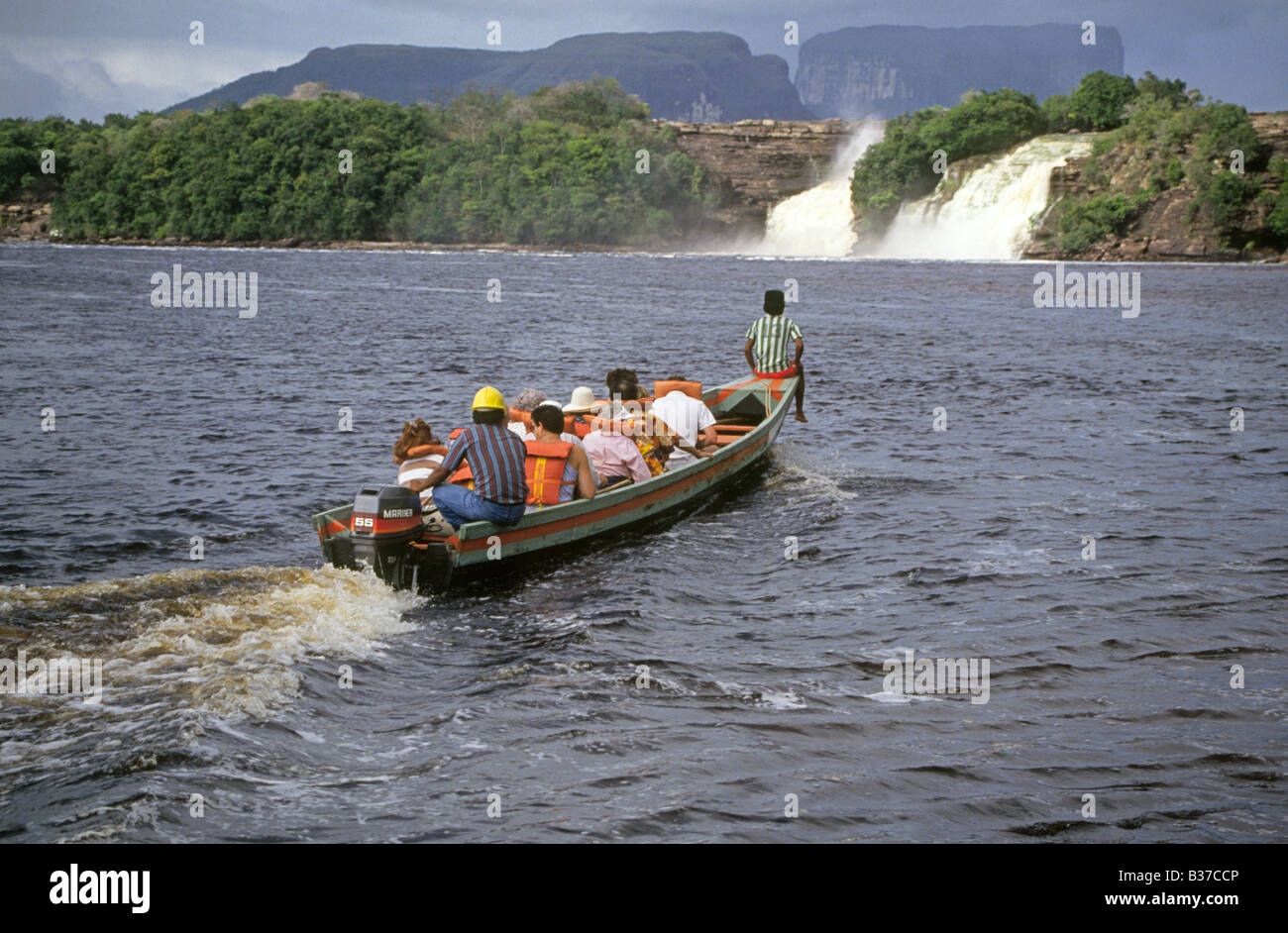 Visitors in a dugout canoe in the Caroni river in Canaima National park in the Gran Sabana region in Bolivar State in Venezuela Stock Photo