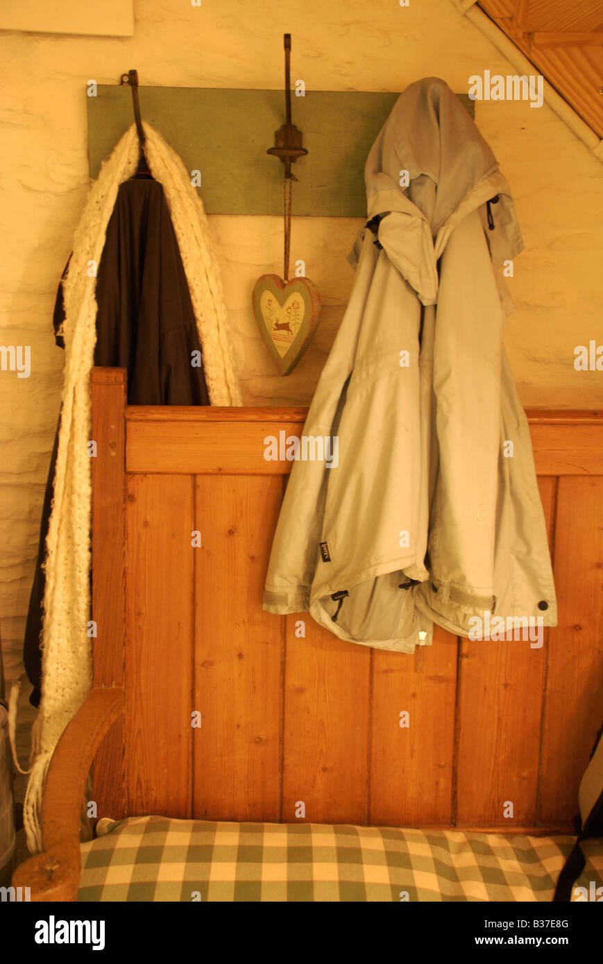 Coats hanging home hi-res stock photography and images - Alamy