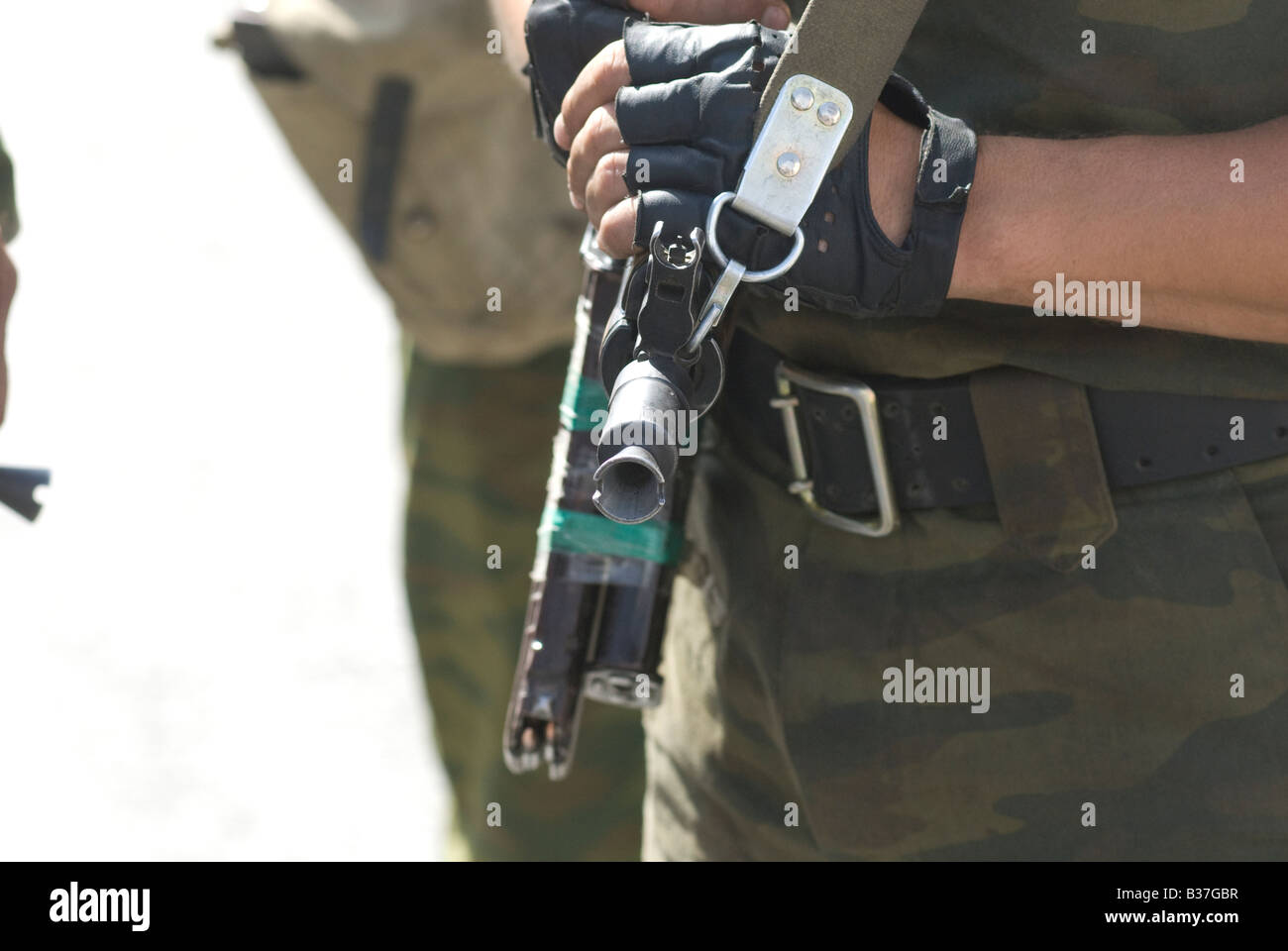 A Russian soldier holds a Kalashnikov ak-47 rifle Stock Photo