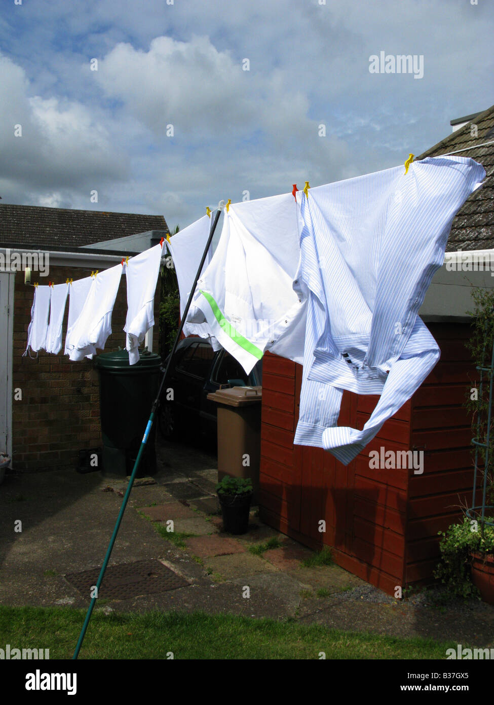 Wash Day, clothes on the washing line, blowing dry in the wind Stock