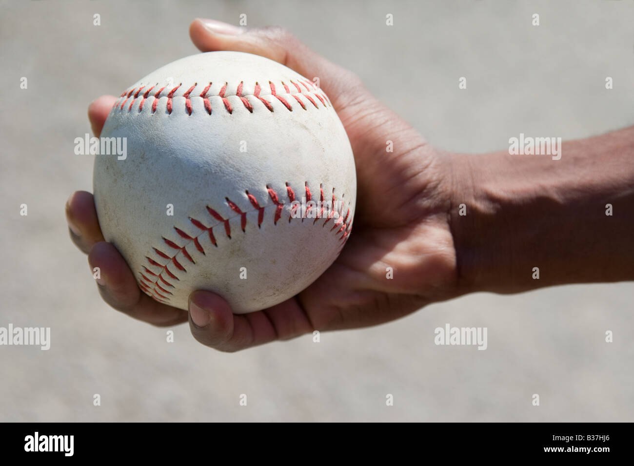 Hand holding a softball Stock Photo Alamy