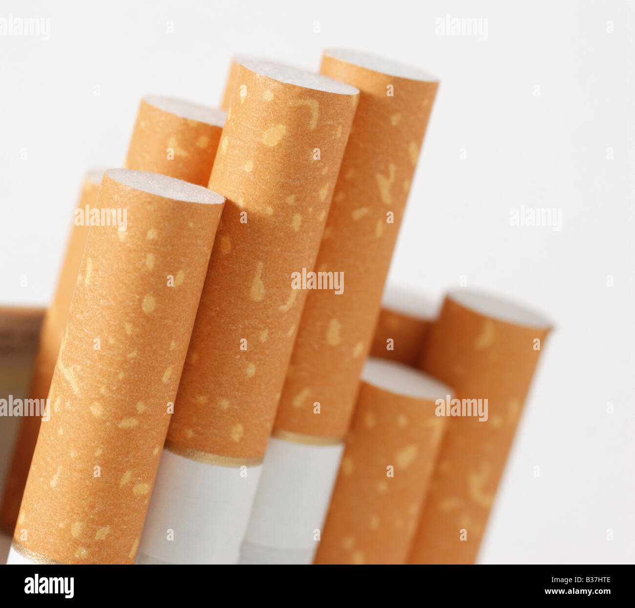 Cigarettes The open pack of cigarettes with the yellow filter Stock