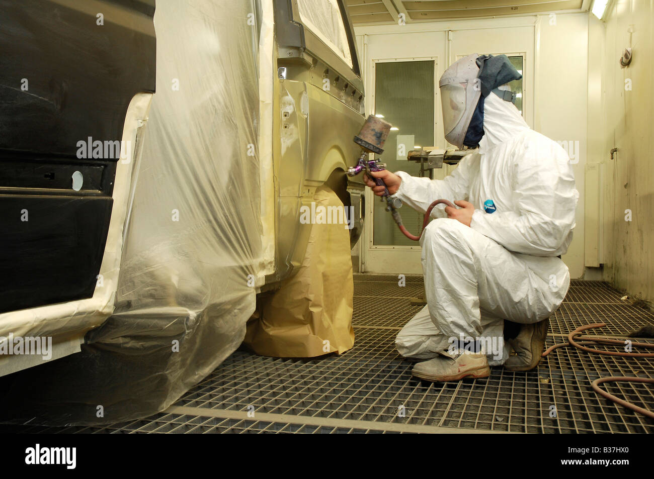Car sprayer painting a vehicle Stock Photo Alamy
