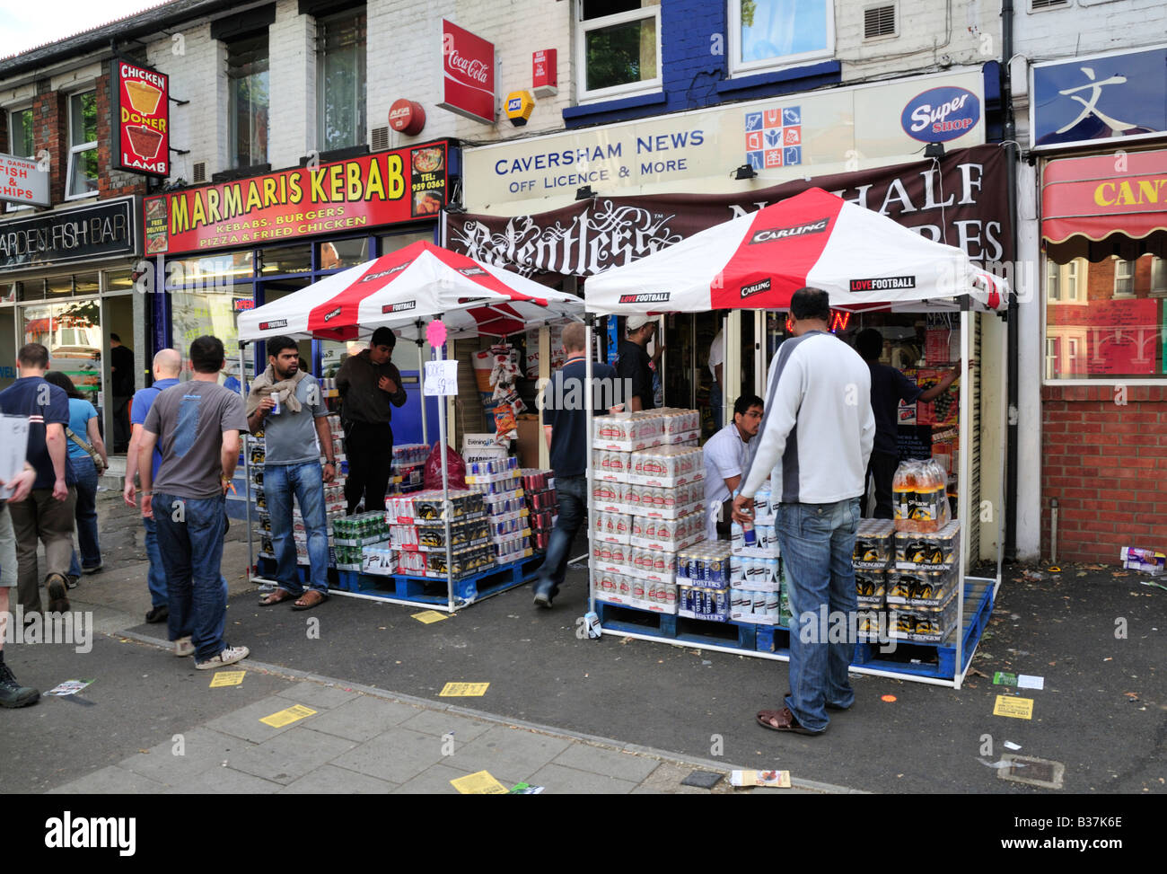 Local traders taking advantage of the increased foot traffic on the Caversham Road during the Reading Festival, Reading, UK 2/2 Stock Photo