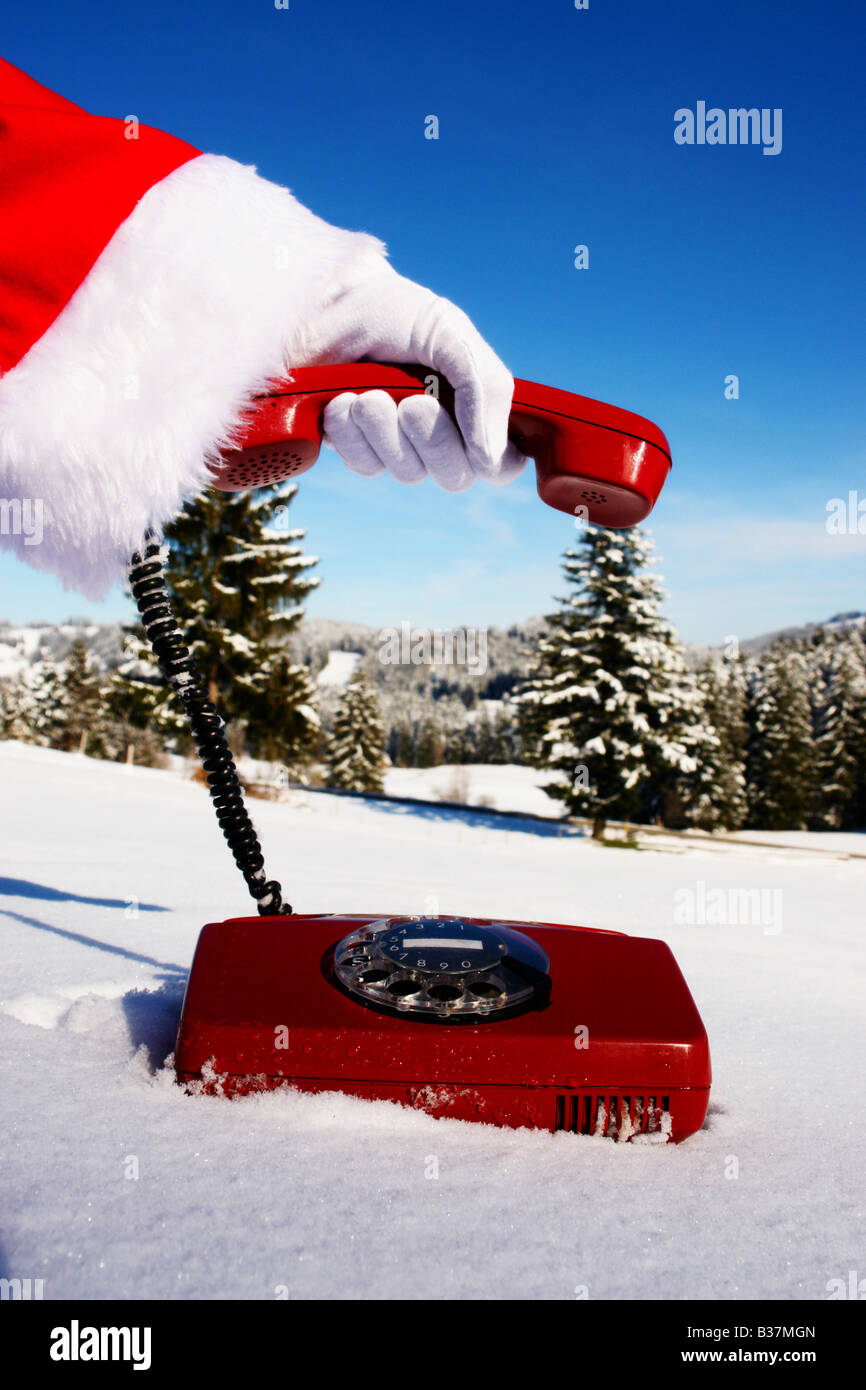 Santa Claus Hotline symbolized by a red retro phone Stock Photo