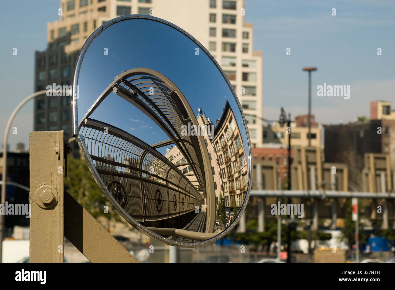 Reflection of a pedestrian bridge in a safety mirror Stock Photo