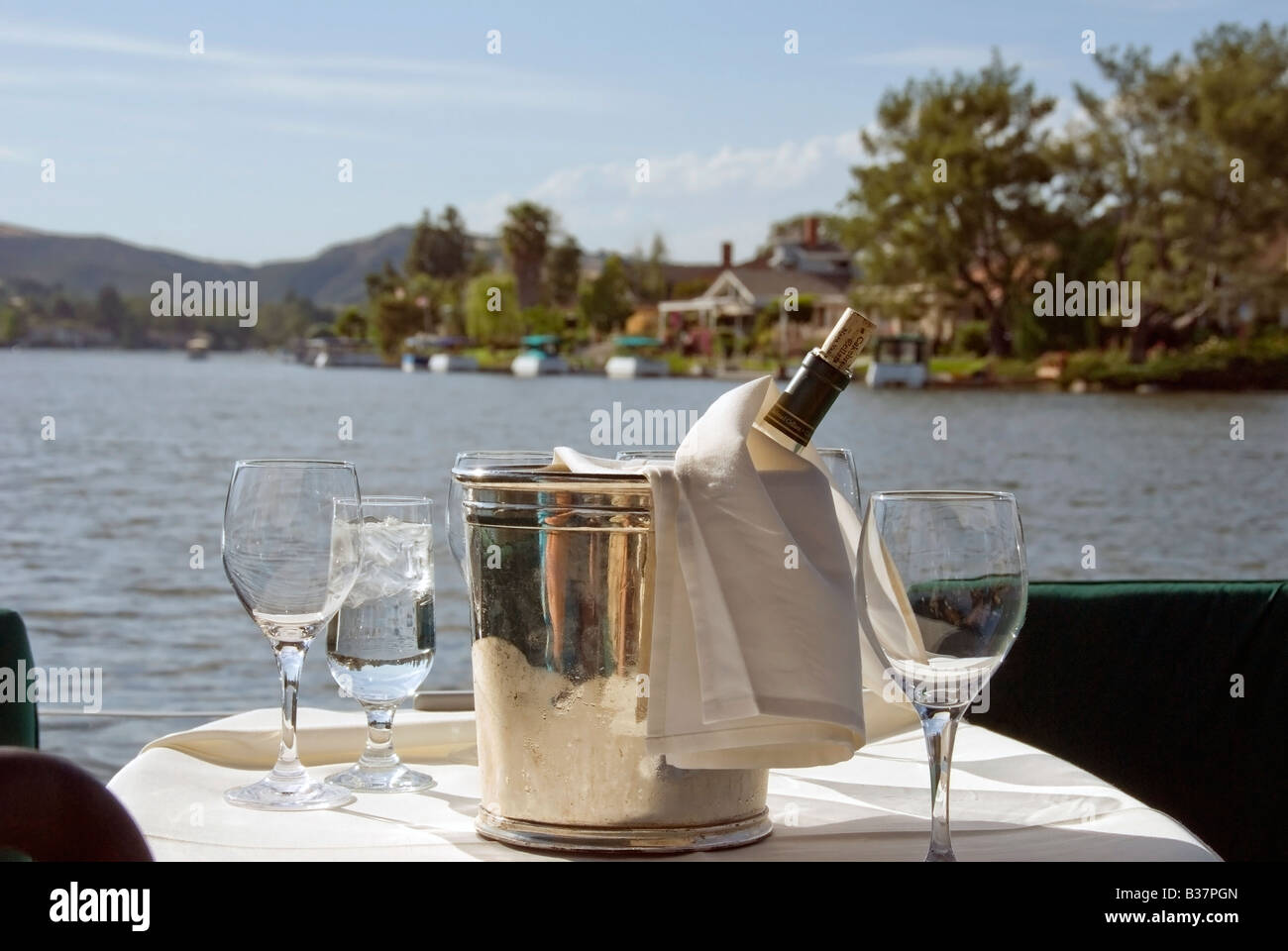 Enjoying wine on boat in Exclusive community Houses, Homes along Lake in Westlake Village, los angeles county, California, elite Stock Photo