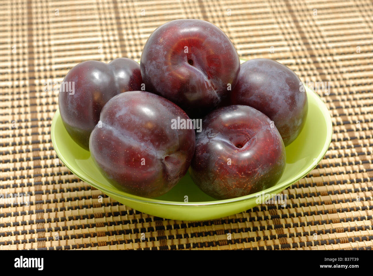 Plums in Plate Stock Photo